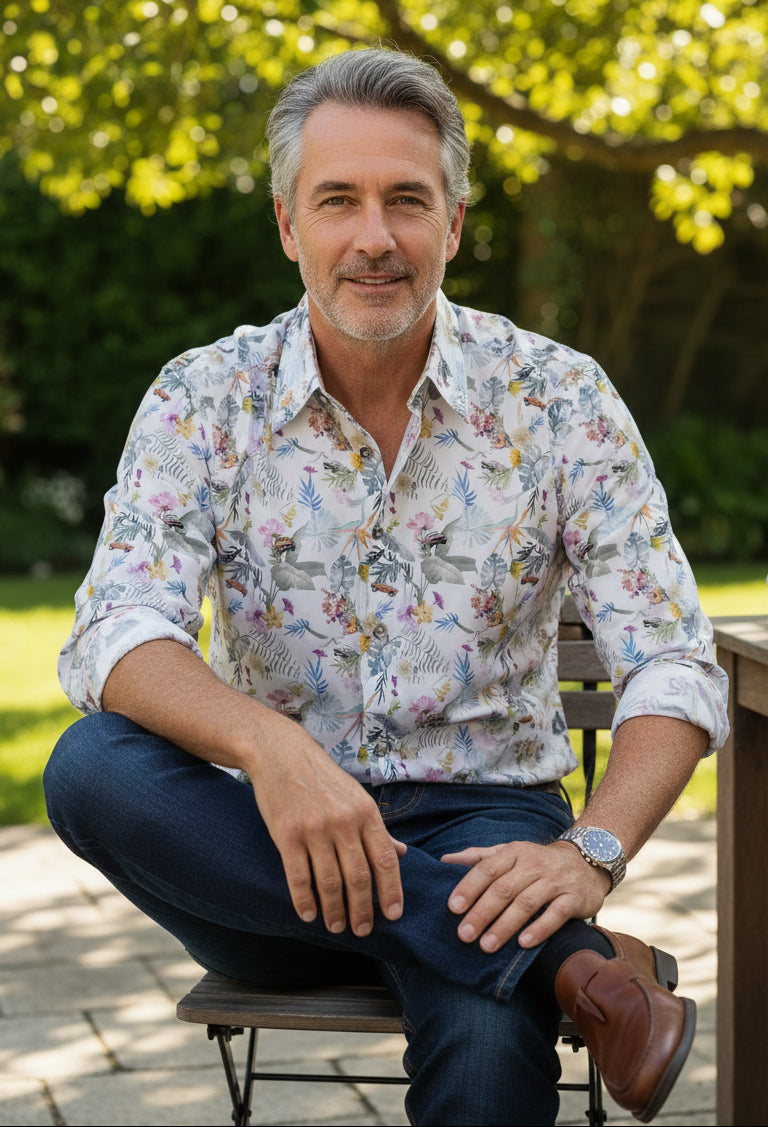 Floral patterned shirt with John Lennon logo on a wooden surface