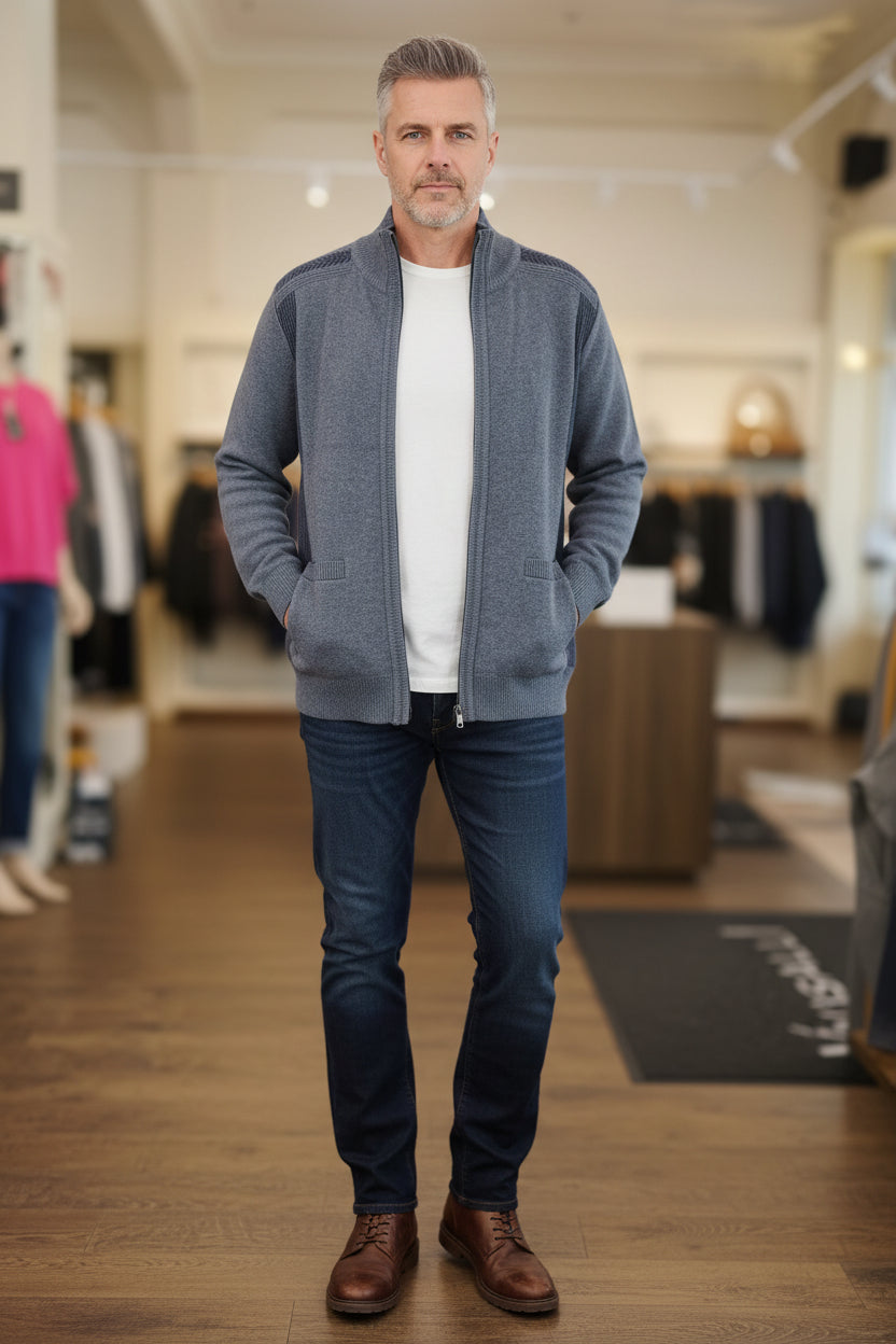 Blue zip-up sweater on a mannequin in a store setting